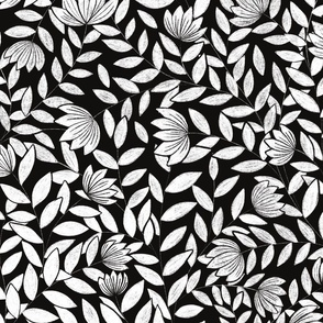black and white flowers in the wind