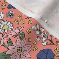 Sketched raw wildflowers spring fields - freehand drawn flower design blue pink yellow on peach
