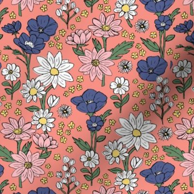Sketched raw wildflowers spring fields - freehand drawn flower design blue pink yellow on peach