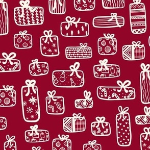 Christmas presents with winter wrapping paper in dark red. 