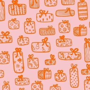Christmas presents with winter wrapping paper in pink and orange.