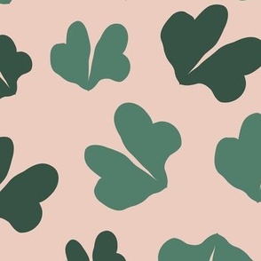 Green Clovers | Large version | dark and light green clover leaves on a peach-beige background