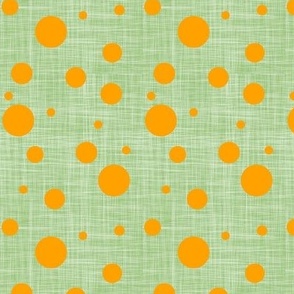 orange dots on green linen texture
