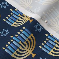 Golden hanukkah menorah with candles on textured deep blue | small