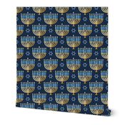 Golden hanukkah menorah with candles on textured deep blue | medium