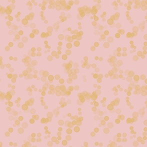 Golden bubbles on blush background 
