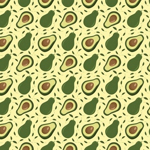 Avocados on Light Yellow Background With Leaves