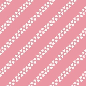 (S) tossed ivory hearts diagonal stripe on pink