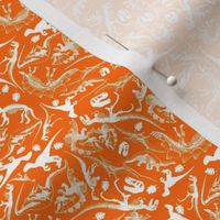 Ditsy Dinosaurs (925) White on Orange