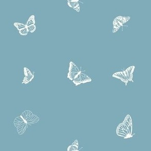Delicate Tiny Butterflies on Blue