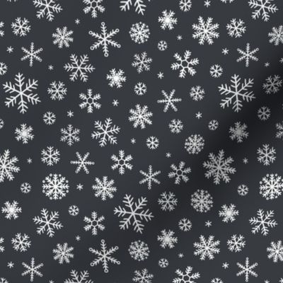 White Snowflakes scattered on charcoal - small scale