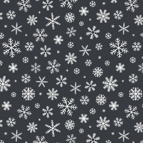 White Snowflakes scattered on charcoal - small scale