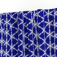 White Block Snowflake lace on blue background 600
