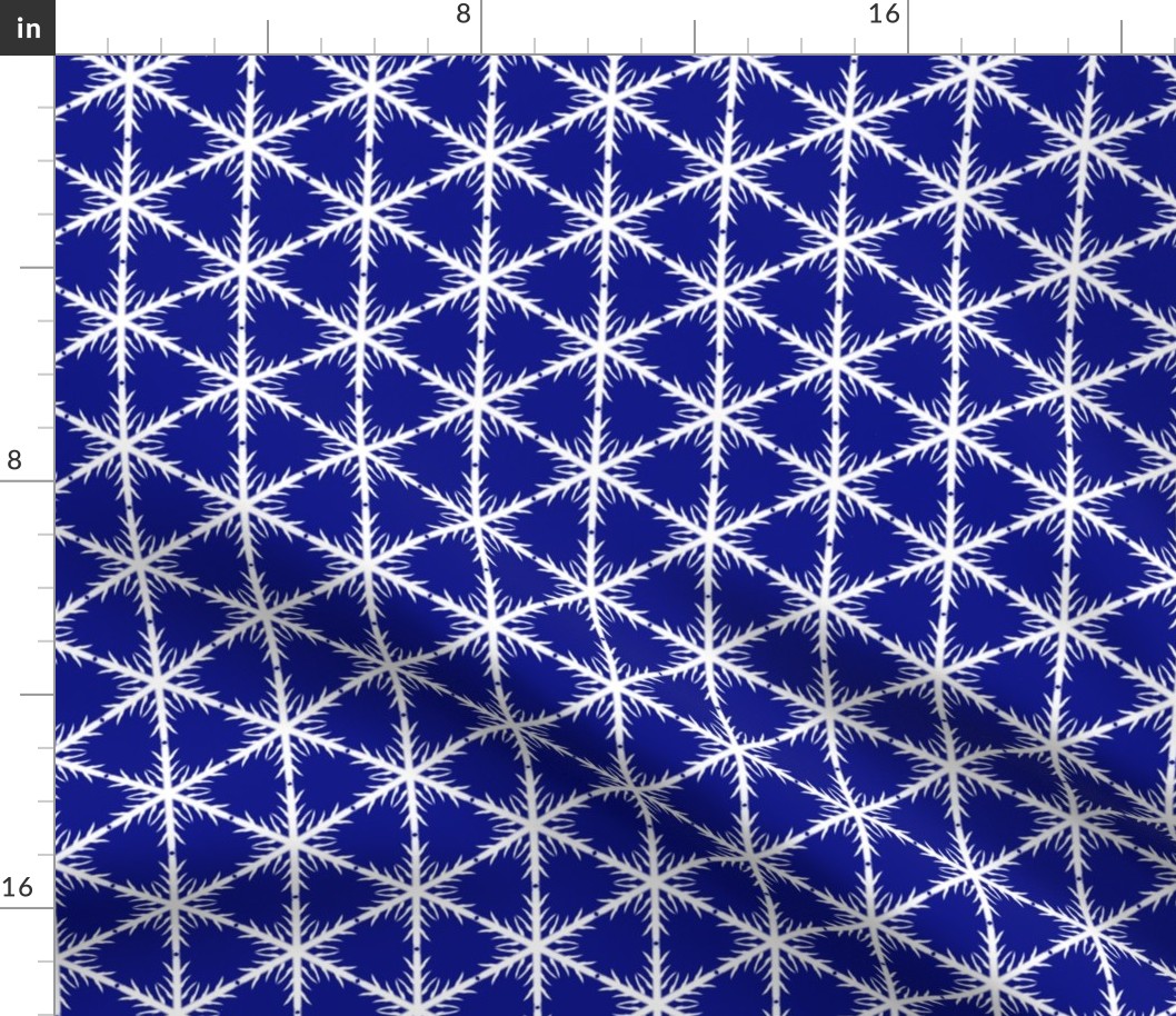 White Block Snowflake lace on blue background 600