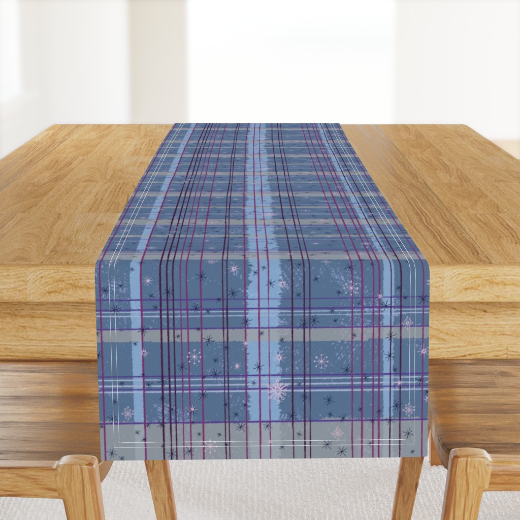 Wonky Tartan with snowflakes and frost in blues, pinks and purples “It is the season for festive tartan”