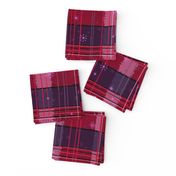 Hand drawn wonky tartan in the frost, in reds, purples and pinks “It is the season for festive tartan”