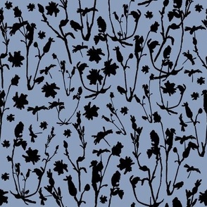 black thistle wildflowers on blue