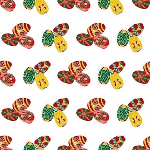Clusters of Colorful Ukrainian Easter Eggs Placed in Horizontal Rows on a White Background
