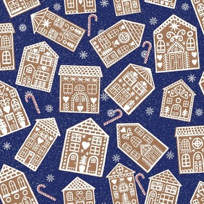 Christmas Gingerbread Cookie Houses with Peppermint Candy Canes on Dark Blue