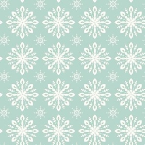 White Winter Snowflakes on a Soft Green Background