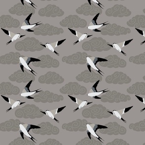 flying swallows / bird in a sky with clouds - grey - small scale