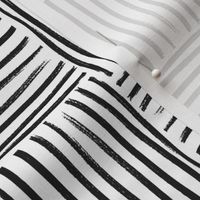 Large scale hand drawn geometric weave stripe block in black and white. 