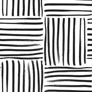 Large scale hand drawn geometric weave stripe block in black and white. 