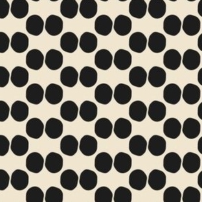 Small scale hand drawn double dots block print pattern in onyx black and beige.