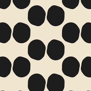 Large scale hand drawn double dots block print pattern in onyx black and beige.
