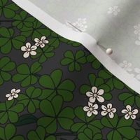 St Patrick's Day shamrock garden - retro clover plants and spring flowers dark olive green charcoal gray 