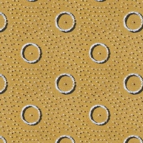 rings and dots on gold 