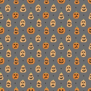 Small Halloween Jack o Lantern Pumpkins with Emotions on Gray