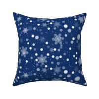 Falling snowflakes on blue