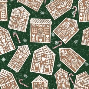 Christmas Gingerbread Cookie Houses with Peppermint Candy Canes on Dark Green