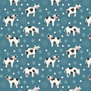 Spotted  milk cows and flowers on blue background / pcc