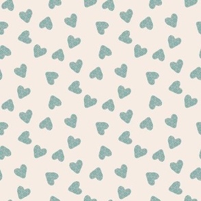 Cute hearts in green on white cream background 