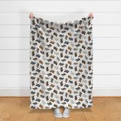 Trotting Finnish Lapphund and paw prints - white
