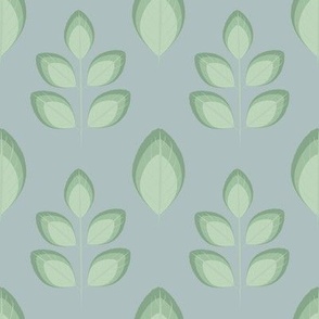 Seamless Pattern of Green Leaves on a Light Blue Background