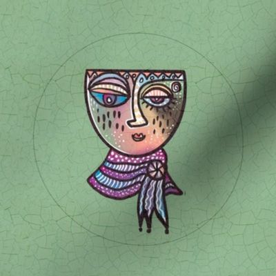 Surrealist whimsical doodled face in pastels embroidery hoop in 8” swatch for 6” embroidery hoop on sage green crackle background 5
