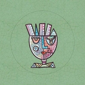 Surrealist whimsical doodled face in pastels embroidery hoop in 8” swatch for 6” embroidery hoop on sage green crackle background 4