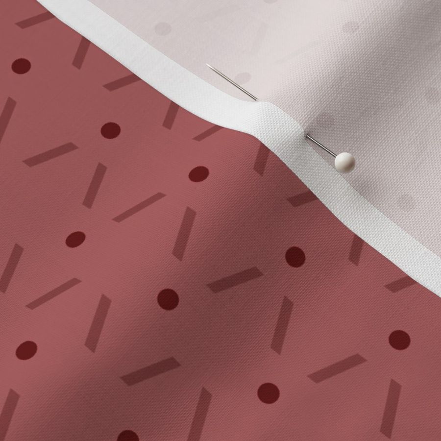 MICRO - Lines of red dots and dashes arranged as clean geometric pattern