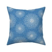 White Mandalas and snow on a cyan blue background - medium scale