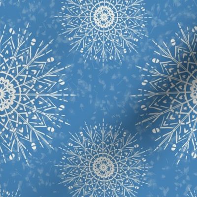 White Mandalas and snow on a cyan blue background - medium scale