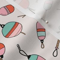 Out on the boat - fishing boat buoys freehand tossed retro marine design coral pink on sand