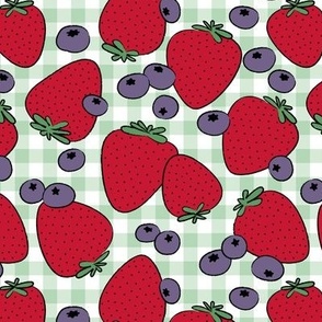 Summer days in the park - retro fruit picnic with forest fruits strawberries and blueberries red purple on mint