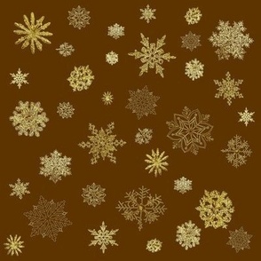 flocons de neige dorés sur fond chocolat 