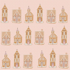 Snowy gingerbread houses on pink