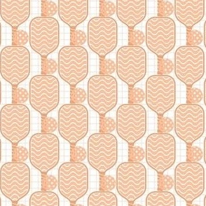 Small Scale Pickleball Paddles and Balls in Peach Fuzz Pantone Color of The Year 2024