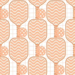 Large Scale Pickleball Paddles and Balls in Peach Fuzz Pantone Color of The Year 2024
