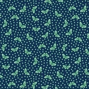 Blue and green polka dot pattern with simple butterflies all over - small print.